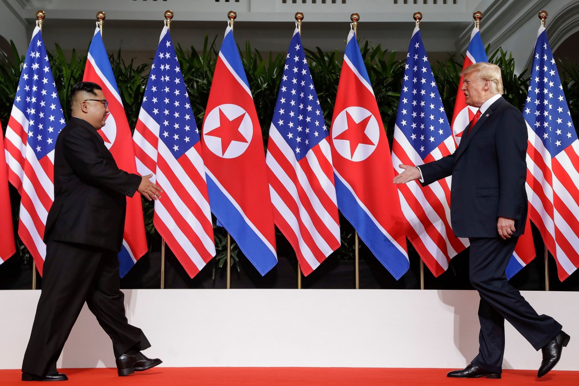 Trump and Kim shaking hands