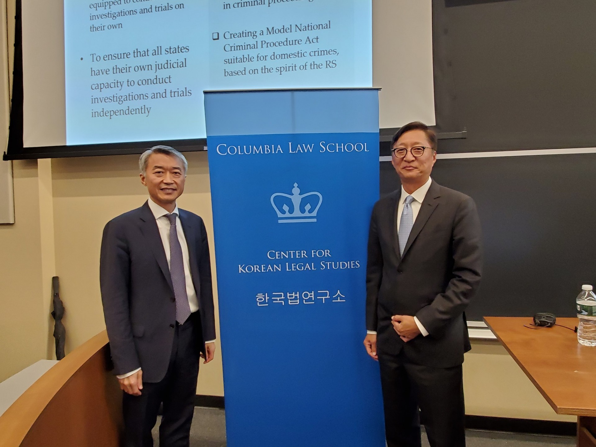Judge Chung Chang-ho and Professor Jeong-Ho Roh Two men with CKLS banner