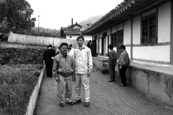 two men standing next to each other